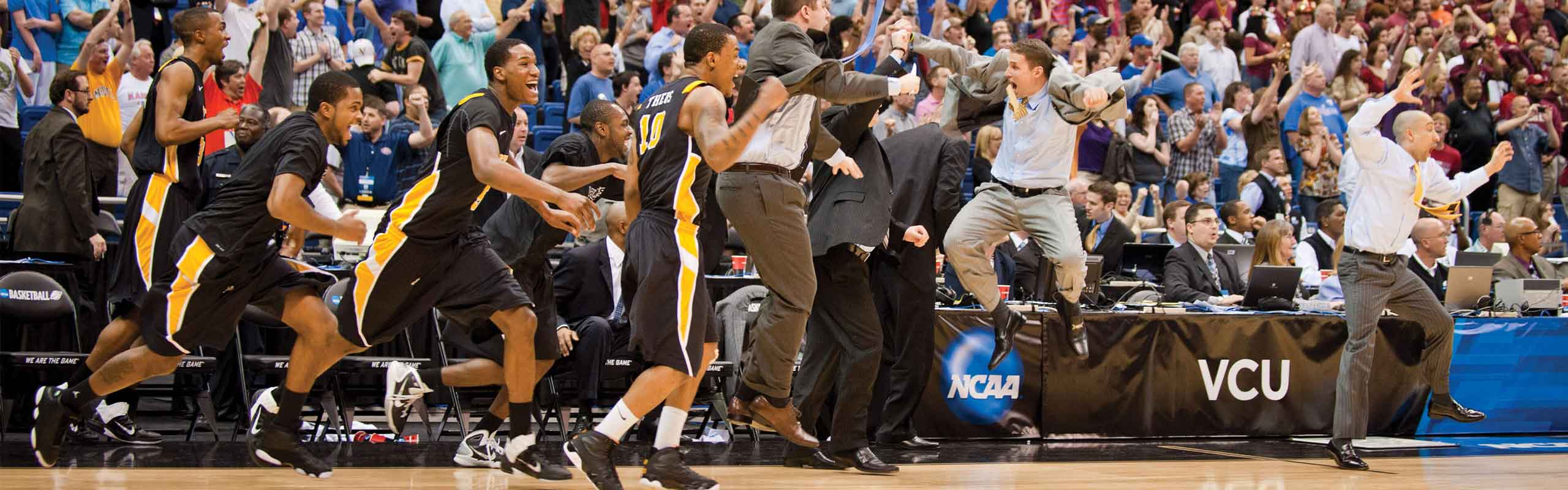 VCU players and coaches erupt as the Rams upset Florida State to advance to the Elite Eight in the 2011 Final Four tournament.